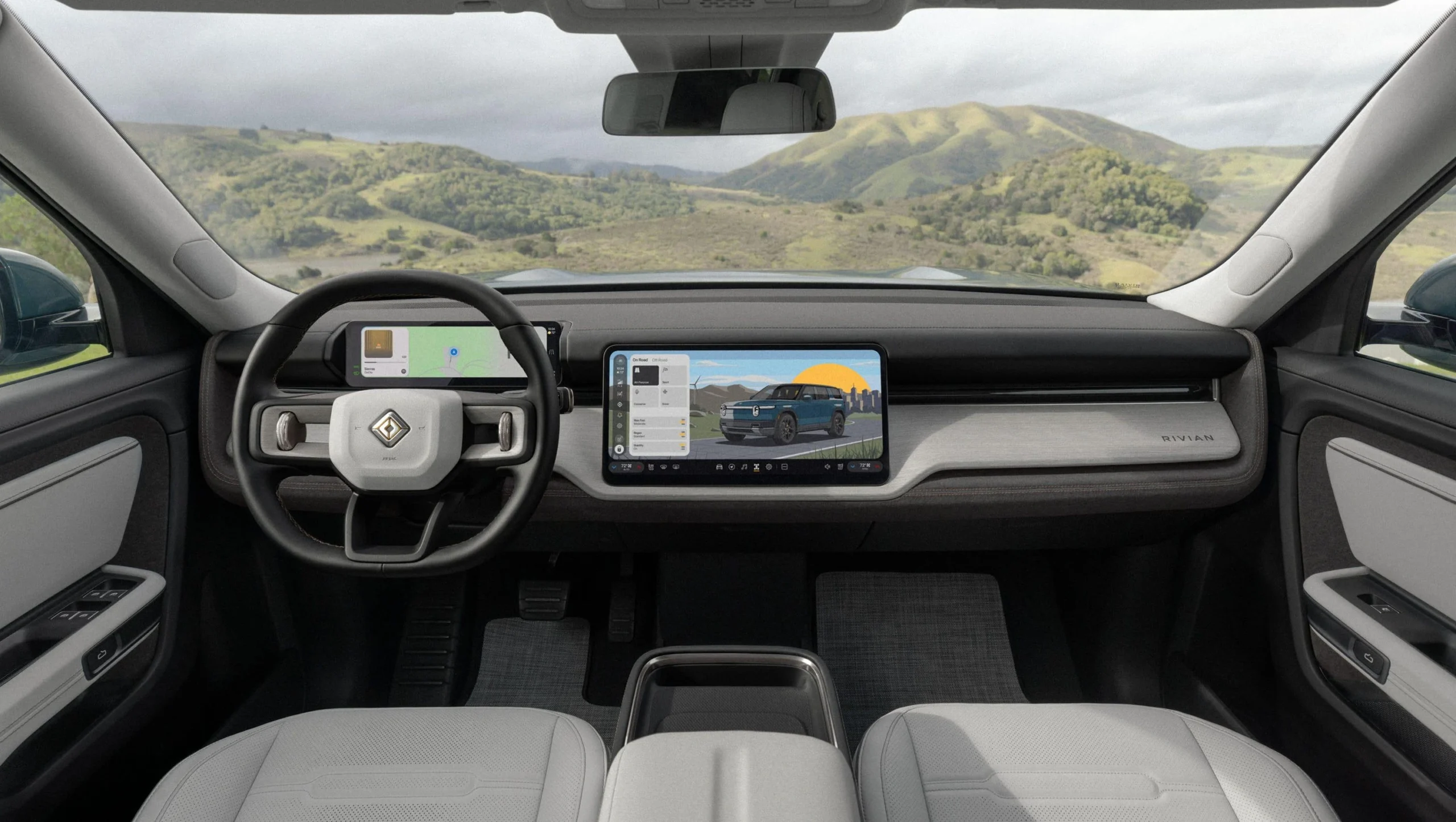 Rivian R2 electric SUV dashboard, steering wheel and central touchscreen
