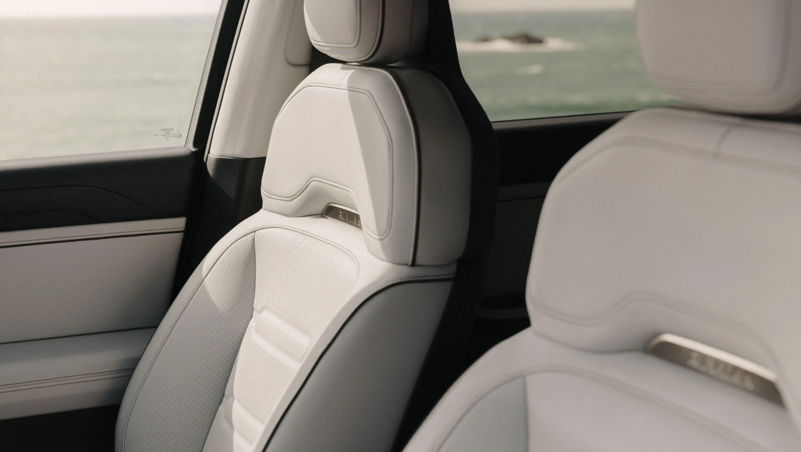 Rivian R2 front seats with premium upholstery and ventilated-seat features